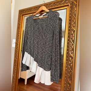 Sweet black and white long sleeve top with ruffled bottom